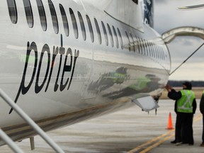 A Porter Airlines Bombardier Q400 lands at Windsor International Airport in this 2011 file photo. (DAX MELMER/The Windsor Star)