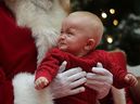 Camden Fleming, 8 months old, was less than impressed with his first encounter with Santa during a photo shoot at the Devonshire Mall in Windsor, Ontario, on Monday, December 17, 2012. (Dan Janis/Windsor Star)