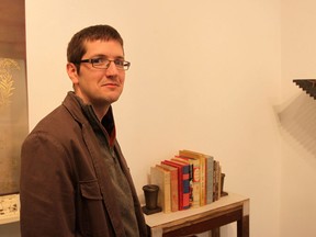 Windsor artist Mike Marcon, 37, stands next to shelf adaptation "Nationalist Book Cart" on Saturday, April 9, 2011 for Artcite Inc.'s experimental art exhibit Artseen 13 — Shelf Life. Artists were each given a nine inch by 23 inch pine shelf and over 60 shelves were returned for the exhibit which runs until April 23. (DYLAN KRISTY/Windsor Star).