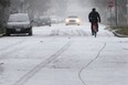 A cyclist cruises down Somme Avenue during a snow fall in this 2012 file photo. (DAN JANISSE/The Windsor Star)