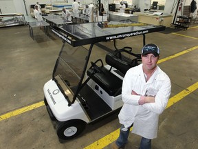 Sean Moore is CEO of Unconquered Sun Solar Technologies, which expanded to include solar-powered golf carts. The company is retrofitting golf carts, installing a solar panel on the roof. (DAN JANISSE/The Windsor Star)