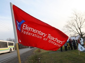 The flag of the Elementary Teachers' Federation of Ontario flies in front of Southwood Public School in Windsor, Ont. on Dec. 18, 2012. (Dan Janisse / The Windsor Star)