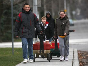 Students at Victoria Public School in Windsor, Ont. were busy Monday, Dec. 19, 2011, hauling more than 2300 food items to the Downtown Mission. A small group of students used wagons to transport some of the items. (DAN JANISSE/The Windsor Star)