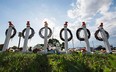 A  memorial stands in Oak Creek, Wis., Tuesday Aug. 7, 2012, near the Sikh Temple of Wisconsin the site of a mass shooting on Sunday.  (AP Photo/Tom Lynn)