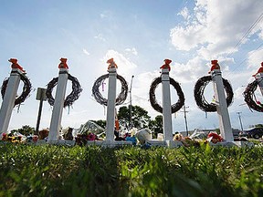 A  memorial stands in Oak Creek, Wis., Tuesday Aug. 7, 2012, near the Sikh Temple of Wisconsin the site of a mass shooting on Sunday.  (AP Photo/Tom Lynn)