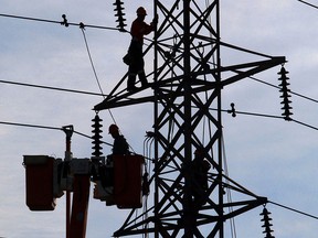 In this file photo, Hydro One workers complete maintenance on high tension power lines along Crawford Avenue in Windsor, Ont. (Windsor Star files)