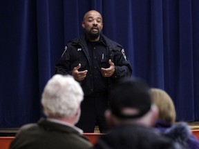 Windsor  Police constable Neil McEachrane speaks to west end residents during a information session on the Neighbourhood Watch program.  (JASON KRYK/ The Windsor Star)