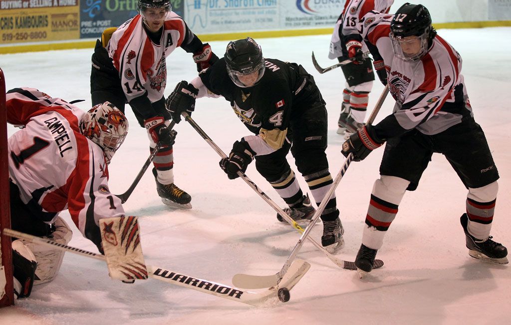 LaSalle Vipers Korey Morgan, centre,  battles for a rebound against Lambton Shores Predators goaltender Brandon Campbell, left, Kyler Keating and Tanner Ferguson, right,  in GOJHL first period action at Vollmer Centre, Wednesday January 2, 2013.