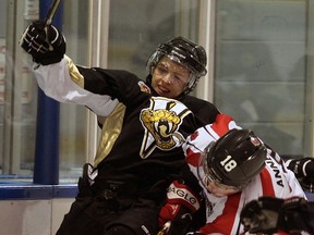 LaSalle Vipers Nathan Veres, top, battles with Lambton Shores Predators Connon Annet in GOJHL first period action at Vollmer Centre, Wednesday January 2, 2013.