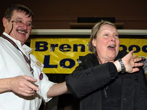 On her 56th birthday, Janice Gourley waves to the crowd after Brentwood Administrator Mark Lennox, left, announced she had won $1,000 in the Brentwood Lottery during a live draw at Brentwood Wednesday January 09, 2013. (NICK BRANCACCIO/The Windsor Star)