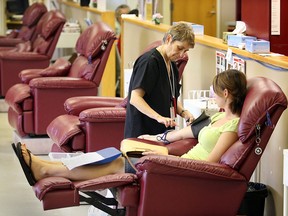 A blood donor is tended to at the Canadian Blood Service clinic on Grand Marais Road East in Windsor. (Windsor Star files)