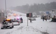 The scene of a multi-vehicle crash that closed the westbound lanes of Highway 401 at Newtonville Road between Port Hope and Clarington in Newcastle, Ont., on Friday, Jan. 25, 2013. At least seven people were injured, some critically. (THE CANADIAN PRESS/Doug Ives)