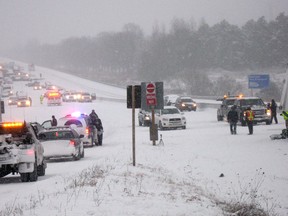 The scene of a multi-vehicle crash that closed the westbound lanes of Highway 401 at Newtonville Road between Port Hope and Clarington in Newcastle, Ont., on Friday, Jan. 25, 2013. At least seven people were injured, some critically. (THE CANADIAN PRESS/Doug Ives)