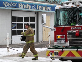 Windsor Fire and Rescue was on the scene at Windsor Body and Fender at 1850 University Avenue West, Saturday, Jan. 5, 2013, where a representative of the Ontario Fire Marshal is investigating a fire that occurred early morning Friday.  (DAX MELMER / The Windsor Star)