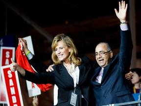 Sandra Pupatello, left, gets endorsed by Harinder Takhar, right, at the Ontario Liberal Leadership convention in Toronto on Saturday, January 26, 2013. THE CANADIAN PRESS/Nathan Denette