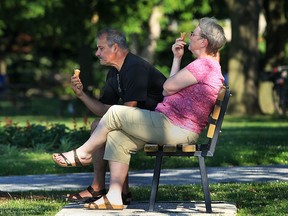 Brian and Donna Zabowski of Oak Park, Mich., enjoy an ice cream cone at Reaume Park in Windsor last summer. Windsor resident Moustafa Zotti is concered that his city doesn't have enough green space. (Windsor Star files)
