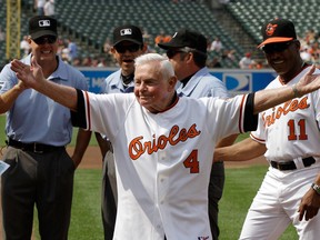 In this Saturday, June 26, 2010 file photo, former Baltimore Orioles manager Earl Weaver waves to the crowd after taking the lineup card out before the start of a game between the Orioles and Washington Nationals, in Baltimore, as members of the Orioles' 1970 team were honored before the start of the game. Weaver, the fiery Hall of Fame manager who won 1,480 games with the Baltimore Orioles, has died, the team announced Saturday, Jan. 19, 2013. He was 82. (AP Photo/Rob Carr, File)