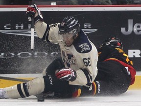 Windsor's Josh Ho-Sang, left, collides with Belleville's Scott Simmonds at the WFCU Centre. (DAX MELMER/The Windsor Star)