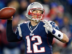 Tom Brady #12 of the New England Patriots looks to throw against the Baltimore Ravens during the 2013 AFC Championship game at Gillette Stadium on January 20, 2013 in Foxboro, Massachusetts.  (Photo by Jim Rogash/Getty Images)