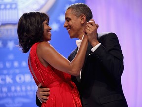 U.S. President Barack Obama and first lady Michelle Obama dance together during the Comander-in-Chief's Inaugural Ball at the Walter Washington Convention Center January 21, 2013 in Washington, DC.
