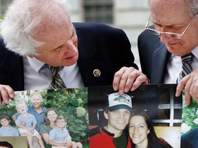 Sander Levin, left ,and his brother Carl Levin, both Democrats from Michigan, look at a 100-foot long banner of photos of people who lost jobs due to the downturn in the auto industry, in Washington, D.C., on May 14, 2009.(Bloomberg News files)