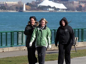 Local residents Mary Pike, left, Denise Addley and Linda Sleiman, right, take a brisk walk along Windsor's riverfront near Dieppe Park January 16, 2013. (NICK BRANCACCIO/The Windsor Star)