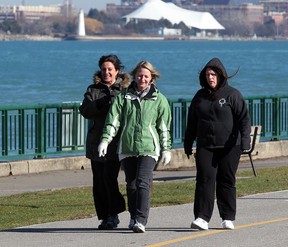 Local residents Mary Pike, left, Denise Addley and Linda Sleiman, right, take a brisk walk along Windsor's riverfront near Dieppe Park January 16, 2013. (NICK BRANCACCIO/The Windsor Star)