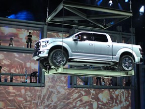 The Ford Atlas Concept is unveiled at the North American International Auto Show at Joe Louis Arena, in Detroit, Michigan, Tuesday, January 15, 2013. Construction workers welding steel beams was used as a backdrop for the unveiling. (DAX MELMER / The Windsor Star)