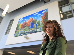 Artist Colleen Seto stands near her artwork entitled Curiosity at Bellewood public school in Windsor, Ontario on January 15, 2013 in Windsor, Ontario.  The artwork was officially unveiled during a morning ceremony. (JASON KRYK/ The Windsor Star)