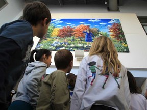 Bellewood public school students look up at work by artist Colleen Seto at the south Windsor school on January 15, 2013.  The artwork was officially unveiled during a morning ceremony.  (JASON KRYK/ The Windsor Star)