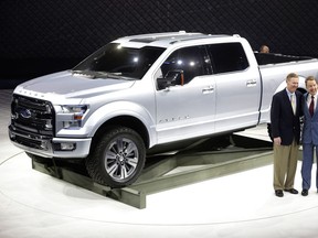 Ford Motor Co. Executive Chairman Bill Ford, right, and President and CEO Alan Mulally stand next to the Ford Atlas concept pickup after its unveil at the North American International Auto Show in Detroit, Tuesday, Jan. 15, 2013. (AP Photo/Carlos Osorio)