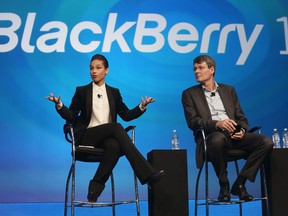 BlackBerry President and Chief Executive Officer Thorsten Heins (R) looks on as new BlackBerry Global Creative Director Alicia Keys speaks at the BlackBerry 10 launch event at Pier 36 in Manhattan on January 30, 2013 in New York City. The new smartphone and mobile operating system is being launched simultaneously in six cities. (Photo by Mario Tama/Getty Images)