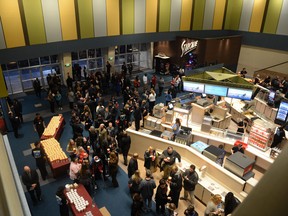 Guests fill the lobby of the Century Aurora cinema, formerly the Century 16, for a reopening and remembrance ceremony Thursday, Jan. 17, 2013 in Aurora, Colo. The theater is where 12 people were killed and dozens injured in a shooting rampage last July. (AP Photo/The Denver Post, RJ Sangosti, Pool)