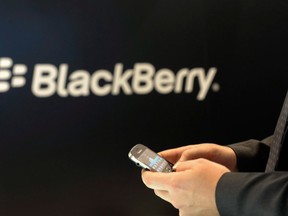 A man holds a BlackBerry in this file photo. THE CANADIAN PRESS/AP-Berthold Stadler