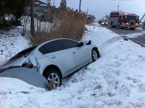Police are investigating a collision on Concession 7 in Windsor, Ont. on Thursday, Jan. 3, 2013, between a 2012 Nissan Ultima, shown here in a ditch, and a Subaru Tribeca. There were 3 people injured and transported to Hotel Dieu-Grace Hospital. (Nick Brancaccio/The Windsor Star)