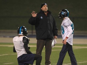 In this file photo, Essex Ravens head coach Glen Mills, centre, runs a practice Tuesday, Nov. 20, 2012, at the University of Windsor Alumni Field. (DAN JANISSE/The Windsor Star)