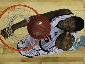 Windsor's Lester Prosper dunks back a rebound in the third quarter as the Windsor Express host the London Lightning at the WFCU Centre, Sunday, January 27, 2013.  (DAX MELMER/The Windsor Star)