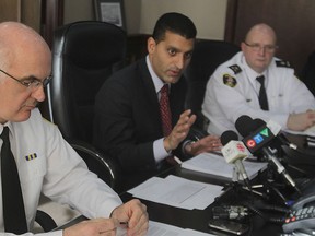 Windsor Police Chief Al Frederick (L) Mayor Eddie Francis (C) and Deputy Chief Rick Derus are shown during a media conference Tuesday, Jan. 15, 2013, at the mayor's office in Windsor, Ont. An arbitrator has ruled that Windsor police will receive an 11.7 per cent wage increase over four years, . (DAN JANISSE/The Windsor Star)