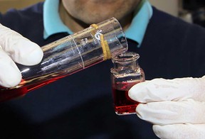 File photo of the level of fluoride being tested in a sample of water at WUC Albert Weeks plant on Wyandotte Street East. (Windsor Star files)