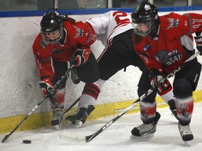 In this file photo, Southwest's Laura Monforton, left, and Jessica Cecile, battle for the puck with Leaside's Miranda Vonhanke, centre, as the Southwest Wildcats host the Leaside Wildcats at Forest Glade Arena, Sunday, January 6, 2013.  (DAX MELMER / The Windsor Star)