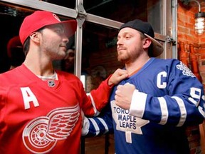 Friends Mark De Sanctis, left, and Matthew Patullo joke around together as they take in some hockey games on Day 1 of the NHL season after a 113-day lockout at John Max Sports and Wings in Windsor, Ont. on Saturday, January 19, 2013. (REBECCA WRIGHT/ The Windsor Star)