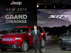 Mike Manley, President and CEO of Jeep, unveils the 2014 Jeep Grand Cherokee, at the North American International Auto Show, Monday, Jan. 14, 2013, in Detroit, Mich. (AP Photo/Tony Ding)