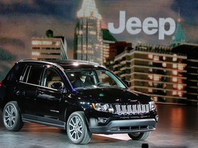 A new Jeep is unveiled at the North American International Auto Show in Detroit, Michigan on Monday, January 14, 2013. (TYLER BROWNBRIDGE / The Windsor Star)