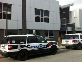 Windsor police vehicles are parked outside St. Joseph's Catholic School after responding to reports a student made a gun threat on Jan. 17, 2013. (Jason Kryk/The Windsor Star)