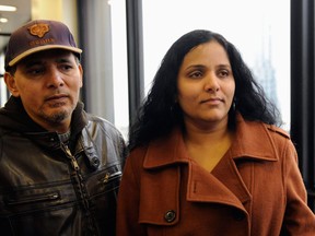 Meraj Khan, right, and Ferozo Khan, sister and brother of Illinois lottery winner Urooj Kahn, who was fatally poisoned with cyanide in July 2012 just as he was about to collect $425,000 in lottery winnings, leave a Cook County courtroom Friday, Jan. 11, 2013, after a judge granted permission to have their brother's body exhumed. Meraj said she hoped her brother would rest in peace but understands a decision to exhume his body. (AP Photo/Chicago Sun-Times, John H. White)