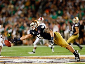 Manti Te'o #5 of the Notre Dame Fighting Irish tries to make a play on the ball against the Alabama Crimson Tide during the 2013 Discover BCS National Championship game at Sun Life Stadium on January 7, 2013 in Miami Gardens, Florida. (Photo by Kevin C. Cox/Getty Images)