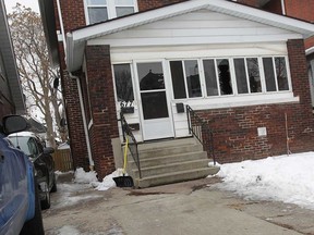 Blood stains are shown Tuesday, Jan 1, 2013, on a driveway in front of 677 Moy Ave. in Windsor, Ont. A man was stabbed at a New Year's Eve party and suffered serious injuries. (DAN JANISSE/The Windsor Star)