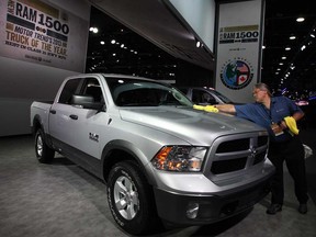 Motor Trend Truck of the Year, Ram 1500, is kept clean by mechanic Dennis Locklear during NAIAS at Detroit's Cobo Centre January 15, 2013. (NICK BRANCACCIO / The Windsor Star)