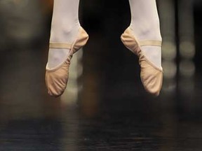 The ballet shoes of a young dancer are shown during a leaping exercise. (DAN JANISSE/The Windsor Star)