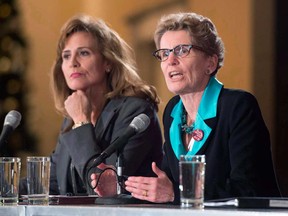 Ontario Liberal party leadership candidates Sandra Pupatello, left, and Kathleen Wynne attend a forum in Toronto on December 6, 2012. With two female candidates leading the race to replace Premier Dalton McGuinty, Ontario appears set to become Canada's sixth province to be governed by a woman. (THE CANADIAN PRESS/Frank Gunn)